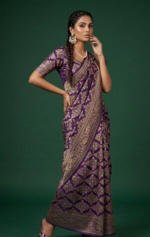 A graceful Purple Banarasi silk saree featuring intricate traditional weaving and a rich rani-colored border.