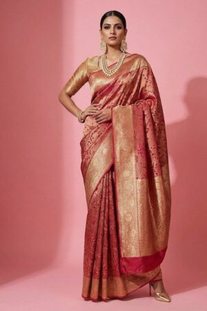 A luxurious rose gold Banarasi silk saree featuring delicate floral weaving and an opulent zari pallu.